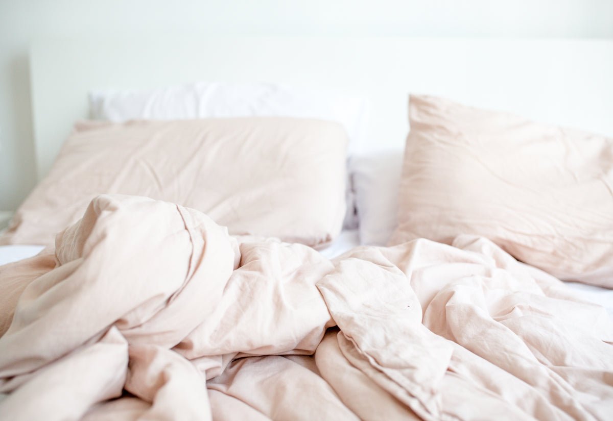 Soft rose bedding in natural light